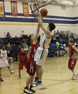 Tonasket senior Wade DeTillian makes a jump shot against Omak during the Tigers’ last home game of the season on Tuesday, Feb. 9. Photo by Terry Mills