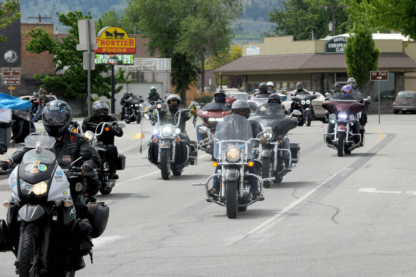 There back! After a four-year absence, the Run for the Border Charity Motorcycle ride returned to Oroville for Armed Services Day on Saturday, May 18. The 150-mile ride from Wenatchee and back is sponsored by the Columbia River Harley Owners Group (HOG). This year 90 machines left Wenatchee for the journey north and arrived in Oroville around noon. <em>Gary DeVon/staff photo </em>