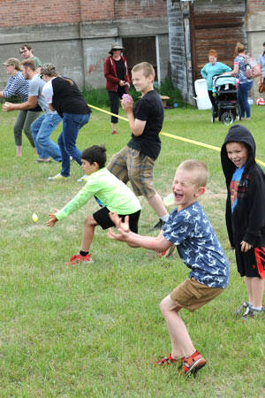 GT File Photo
Among the kids’ games is the water balloon toss, which on a hot day is a fun way to lose if it cools you off. There was also a sack race, egg toss, three-legged sack race and a coin scramble through the sawdust pile.