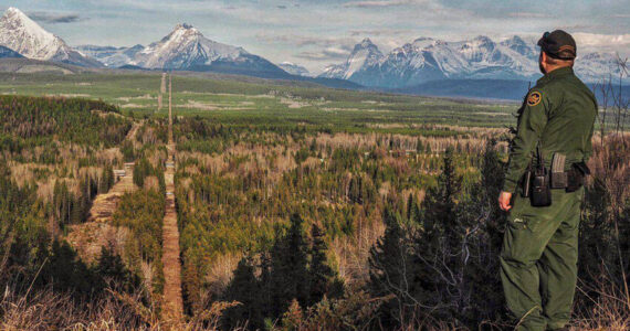 A Border Patrol agent standing watch at the Montana-Canada border in the CBP Spokane Sector. The Spokane Sector covers the U.S.-Canada border along the northwestern section of Montana, part of Idaho, and the eastern part of Washington. <em>U.S. Customs and Border Protection photo</em>