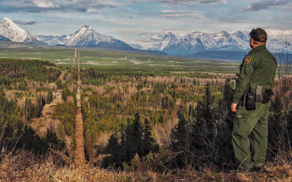 A Border Patrol agent standing watch at the Montana-Canada border in the CBP Spokane Sector. The Spokane Sector covers the U.S.-Canada border along the northwestern section of Montana, part of Idaho, and the eastern part of Washington. <em>U.S. Customs and Border Protection photo</em>