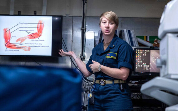 Lt. Alexa Werner, from Oroville, Washington, the ship’s physical therapist aboard Nimitz-class aircraft carrier USS George Washington (CVN 73), displays a muscle diagram during a sick call evaluation training in main medical while underway in the Philippine Sea, Nov. 20, 2024. George Washington is 7th Fleet’s premier forward-deployed aircraft carrier, a long-standing symbol of the United States’ commitment to maintaining a free and open Indo-Pacific region, while operating alongside Allies and partners across the U.S. Navy’s largest numbered fleet. (U.S. Navy photo by Mass Communication Specialist 3rd Class Johnathan M. Meighan)