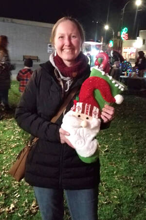 Stephanie Hart and some of the goodies she won by participating in the Elf on a Shelf Hunt sponsored by the Oroville Chamber of Commerce. Angela Larson/staff photo.