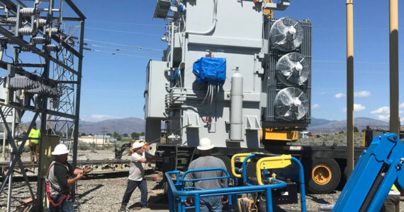 Okanogan County PUD replaced old power transformers in substations throughout the county in 2022 and Tonasket’s substation was completely rebuilt. This transformer in Okanogan replaced an old 108,000-pound transformer (reddish color) with a new 68,000-pound transformer (gray) that improves efficiency and reliability for the electric grid. OKPUD/GT file photo