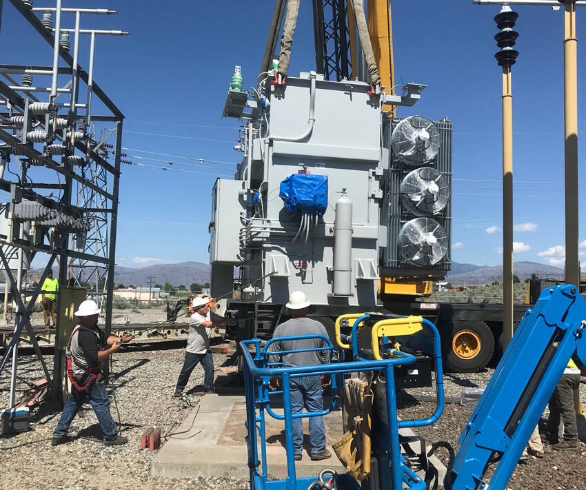 Okanogan County PUD replaced old power transformers in substations throughout the county in 2022 and Tonasket’s substation was completely rebuilt. This transformer in Okanogan replaced an old 108,000-pound transformer (reddish color) with a new 68,000-pound transformer (gray) that improves efficiency and reliability for the electric grid. OKPUD/GT file photo