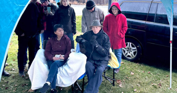 Jeff and Elia Bunnell watch as the new sign naming Oroville’s Triangle Park as Jeff Bunnell Park last Saturday. There were many kind words spoken about Bunnell, who started the Oroville Initiative (TOI) and has volunteered many hours trying to improve Oroville. The former Triangle Park is the project he says he is most proud of.. Gary DeVon/staff photos