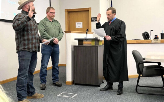 Nick Timm was sworn into the Okanogan County Board of Commissioners at their Monday, Dec. 31 meeting. Timm, left, will serve a four-year term as the District 1 Commissioner. Also taking the oath to serve another term was Andy Hover, who was re-elected to the District 2 position. Submitted photo