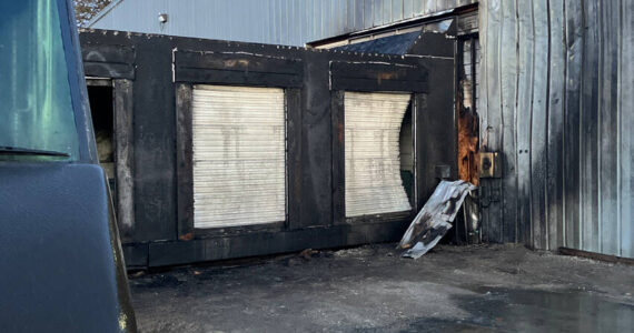 Some of the fire damage at the UPS loading dock in Omak. The fire is suspected to have broken out after a suspect is alleged to have drilled into a UPS truck’s gas tank and a spark from the drill set the truck ablaze. OPD/submitted photo