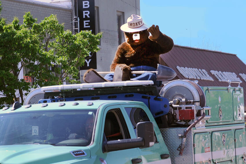 Smokey Bear rides on top of a U.S. Forest Service (USFS) truck in the May Festival Parade. Smokey is a familiar sight at May Fest as well as events around the country and his “Only You Can Prevent Forest Fires” is familiar to nearly every school-age child in the nation. The Department of Natural Resources (DNR) has teamed up with none other than the iconic Smokey Bear. The DNR has received funding from the USFS to wrap 10 trailers with Smokey’s image, as well as fire prevention information and resources. Gary DeVon/GT file photo