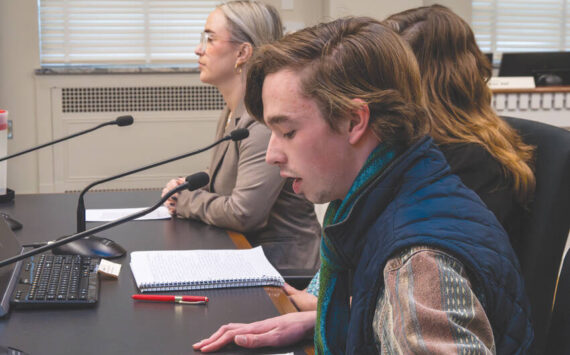 Sebastian Ford (front), a Bainbridge resident and a high school student, shares his testimony during a public hearing for HB 1631 on Feb. 4. Ford is one of the people who spearheaded the drafting of the bill. Photo by Juan Jocom